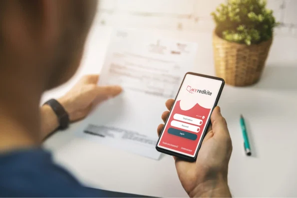 A person using the 'myRedKite' application to access cancer patients financial help