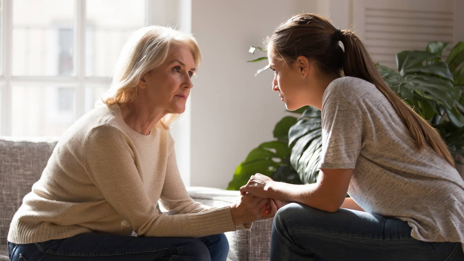 a mother and a daughter in a deep conversation