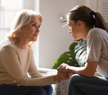 a mother and a daughter in a deep conversation